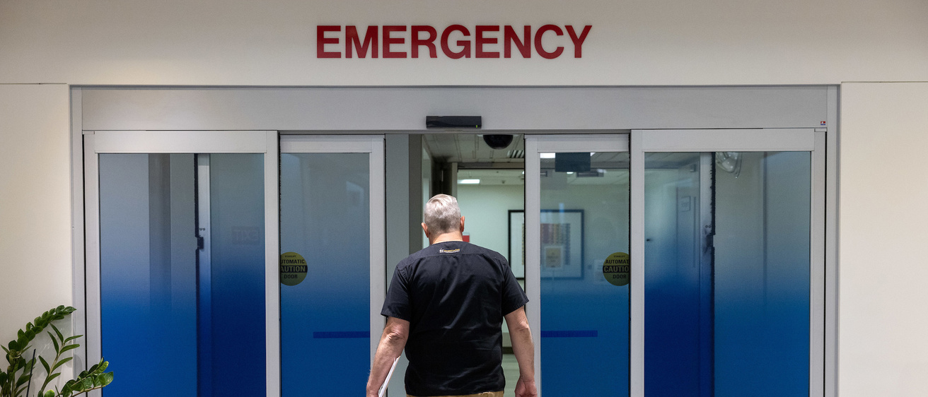 Dr. Clancy walking through Emergency Room entrance